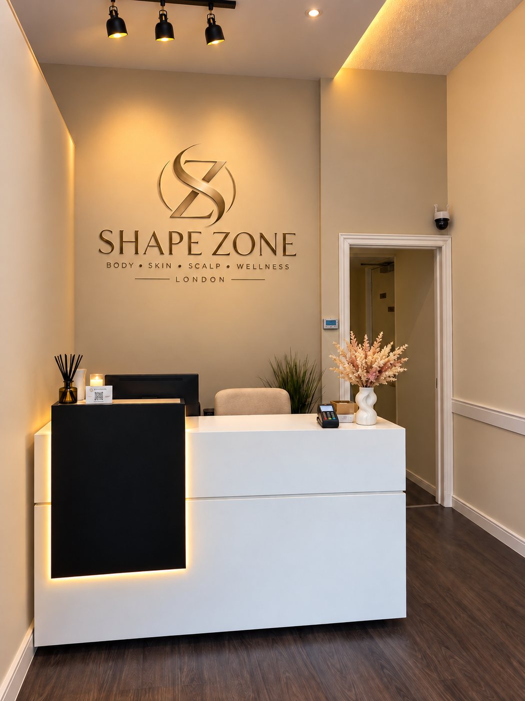Shape Zone reception with the gold logo wall, 407 Wandsworth Road, London SW8